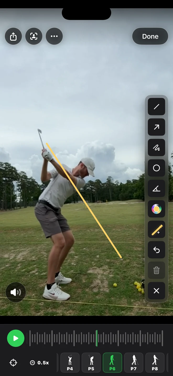Drawing tools open over a golf swing video with colored guide lines